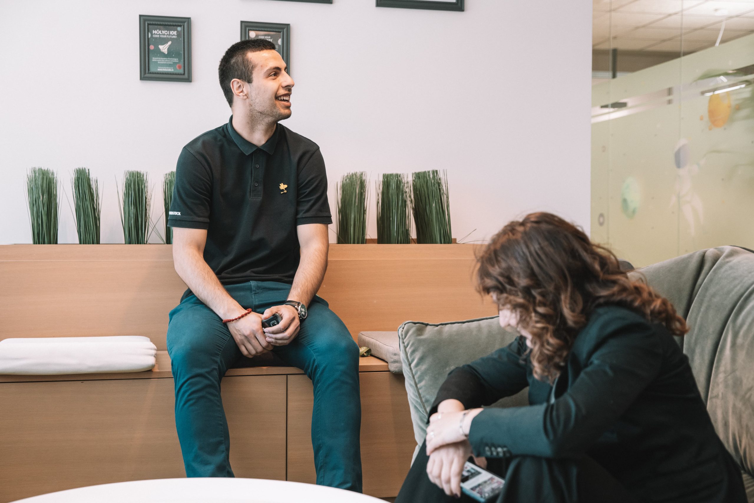 A senior software engineer laughing in an office