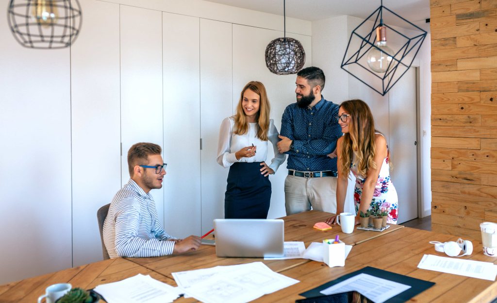 A senior software engineer having a team meeting